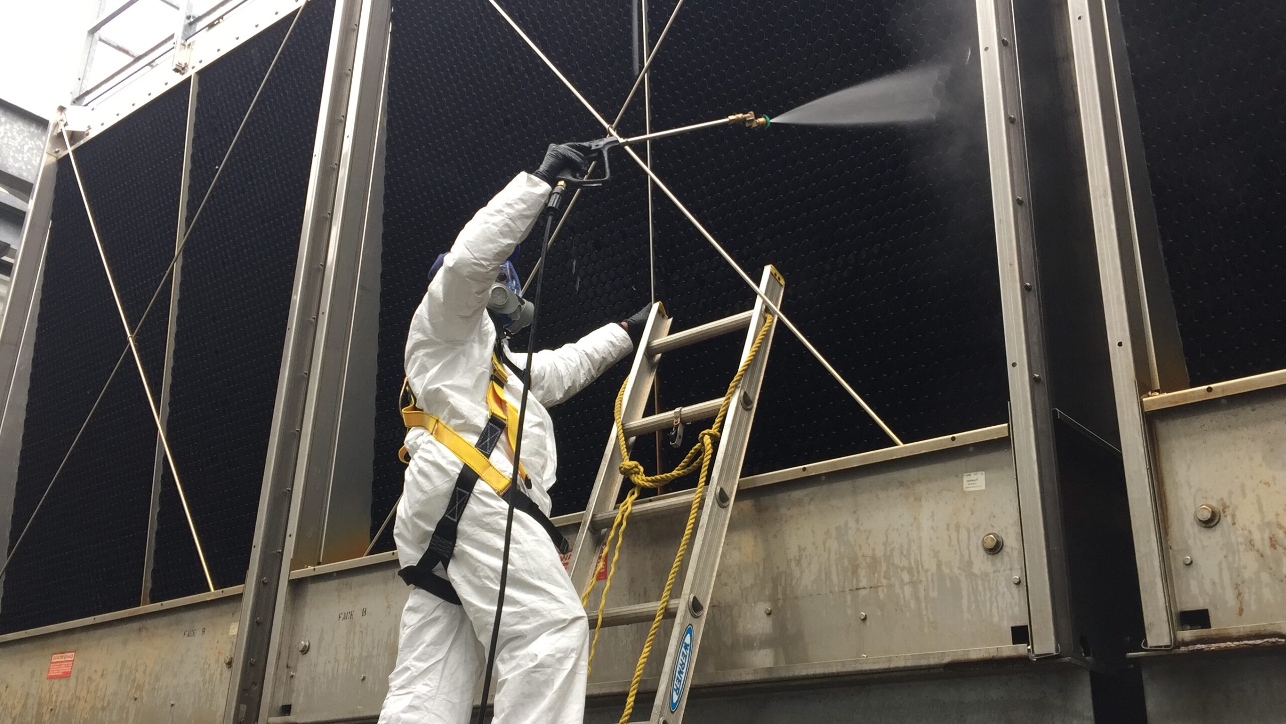 Safety King team member wearing PPE during cooling tower cleaning service