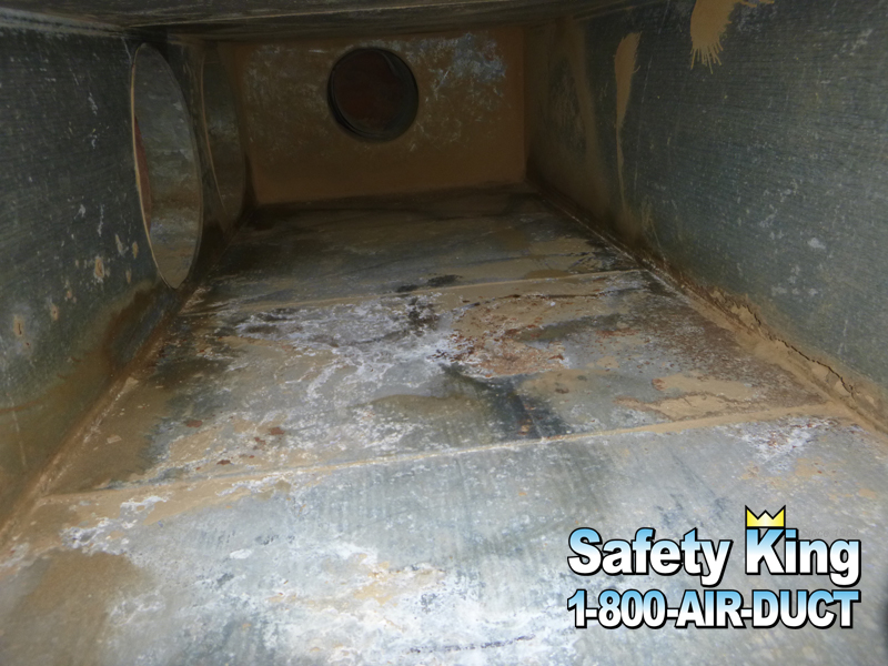 Before example showing buildup inside accessible ductwork